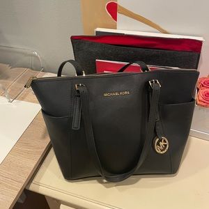 Michael Kors bag. Worn a few times. Like new.